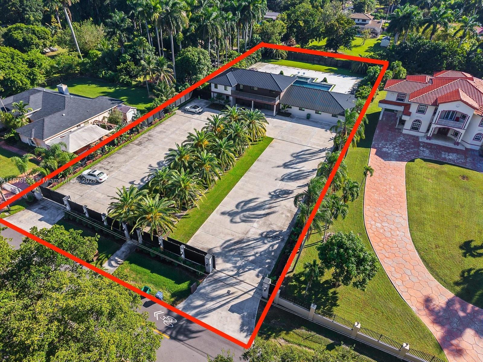 An aerial view shows a large residential property with a long driveway and swimming pool — 280 NE 156th St, Miami FL 33162, MIAMI, FL