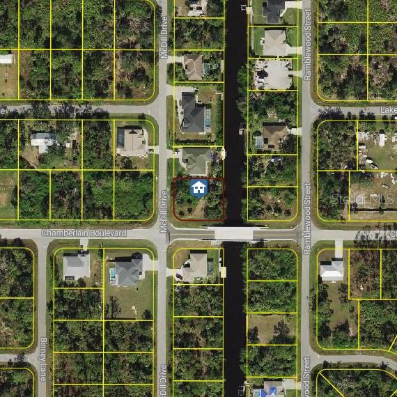 This is an aerial map showing a vacant lot highlighted in red along a canal — 12154 CHAMBERLAIN BOULEVARD, PORT CHARLOTTE, FL