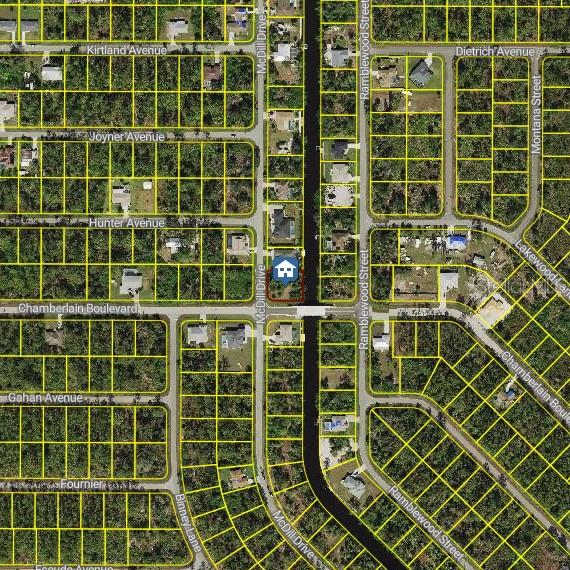 This is an aerial map showing a residential lot highlighted in a neighborhood with canals — 12154 CHAMBERLAIN BOULEVARD, PORT CHARLOTTE, FL