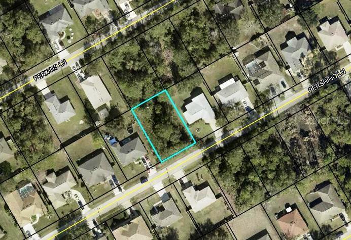 This is an aerial map view of a vacant residential lot outlined in blue — 25 PERSHING LANE, PALM COAST, FL
