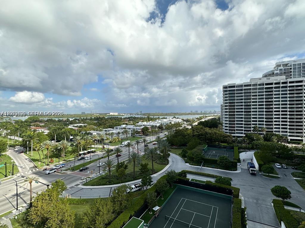 An elevated view shows a tennis court, a road with palm trees, and a large building — 10185 Collins Ave # 1103, Bal Harbour FL 33154, BAL HARBOUR, FL