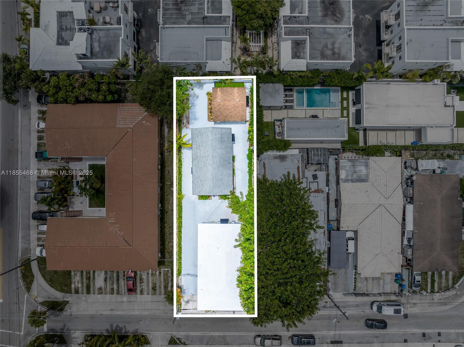 An aerial view shows a rectangular property lot containing three separate buildings and paved areas — 1028 SW 9th Ave, Miami FL 33130, MIAMI, FL