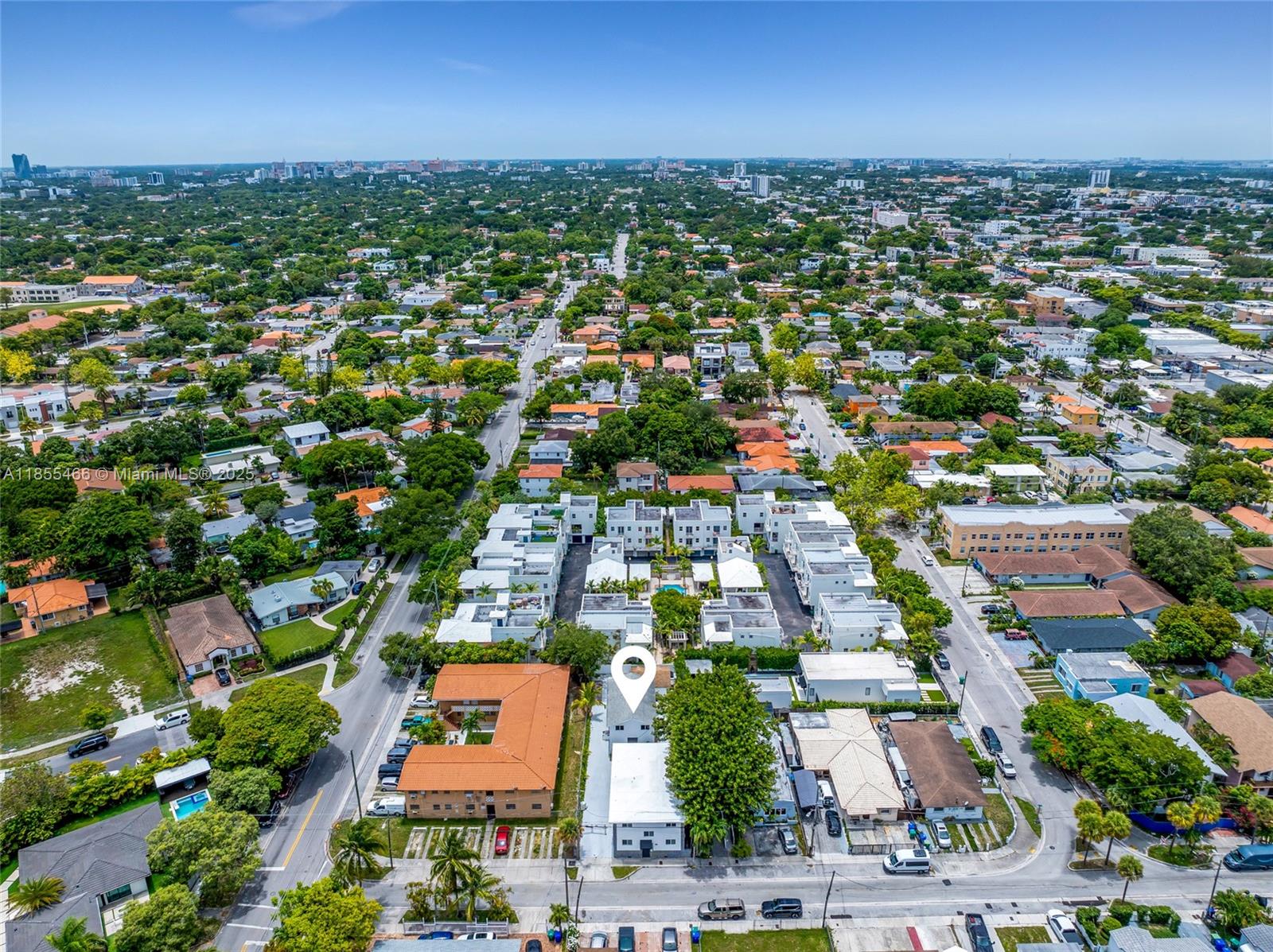 An aerial view shows a residential neighborhood with a marked property and surrounding houses — 1028 SW 9th Ave, Miami FL 33130, MIAMI, FL
