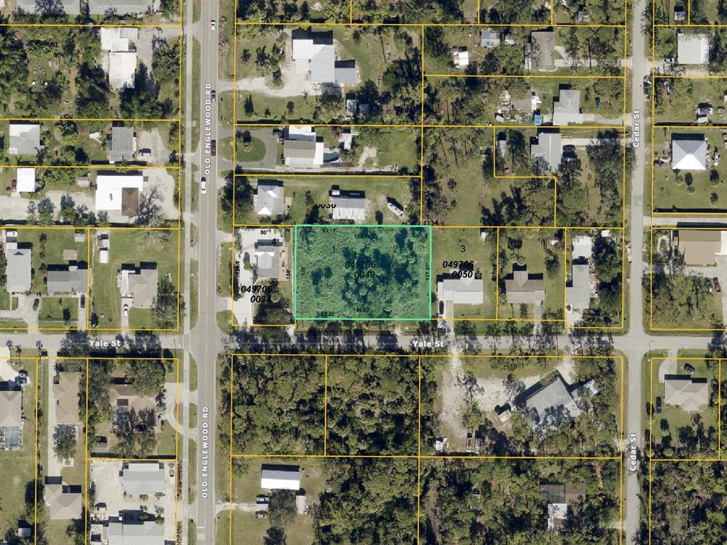 This is an aerial map showing a vacant lot highlighted in green within a residential neighborhood — YALE LOT 1 & 2 STREET, ENGLEWOOD, FL