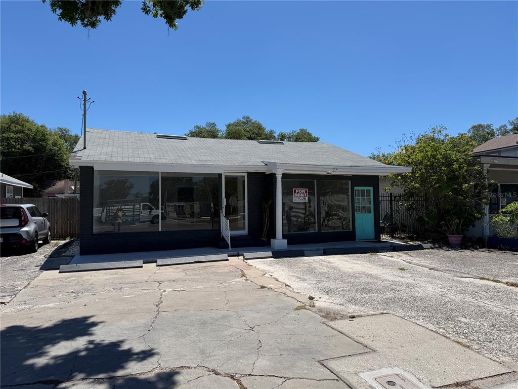 A single-story commercial building with a black brick exterior and a paved parking lot — 1771 CLEARWATER LARGO ROAD, CLEARWATER, FL