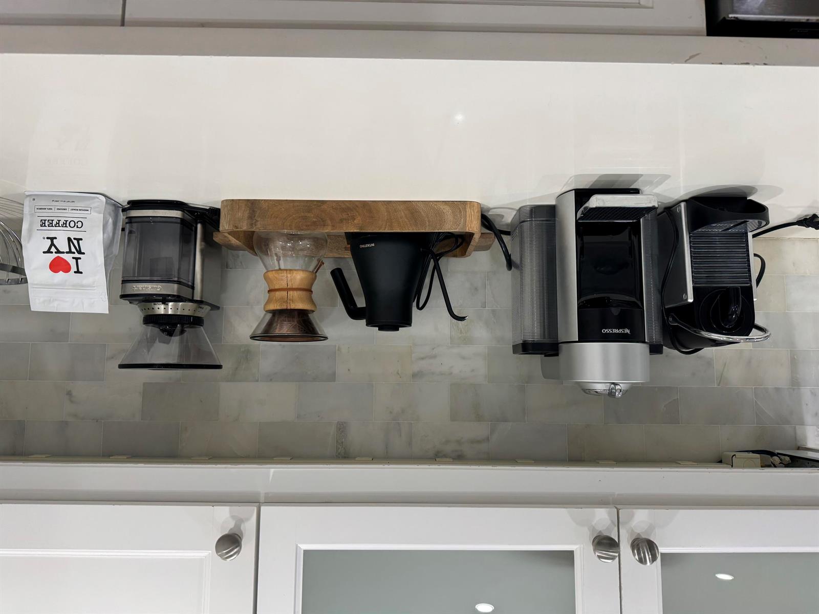 A kitchen counter features a coffee grinder, pour-over carafe, electric kettle, and Nespresso machine — 5501 N Ocean Boulevard, Ocean Ridge FL 33435, OCEAN RIDGE, FL