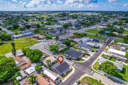 An aerial view shows a residential neighborhood with a marked house and surrounding streets — 655 SW 5th St, Homestead FL 33030, HOMESTEAD, FL