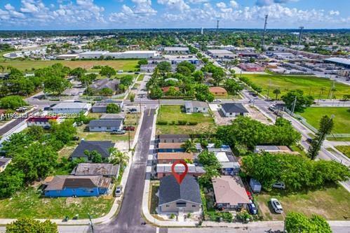 An aerial view shows a residential neighborhood with a highlighted house in the foreground — 655 SW 5th St, Homestead FL 33030, HOMESTEAD, FL