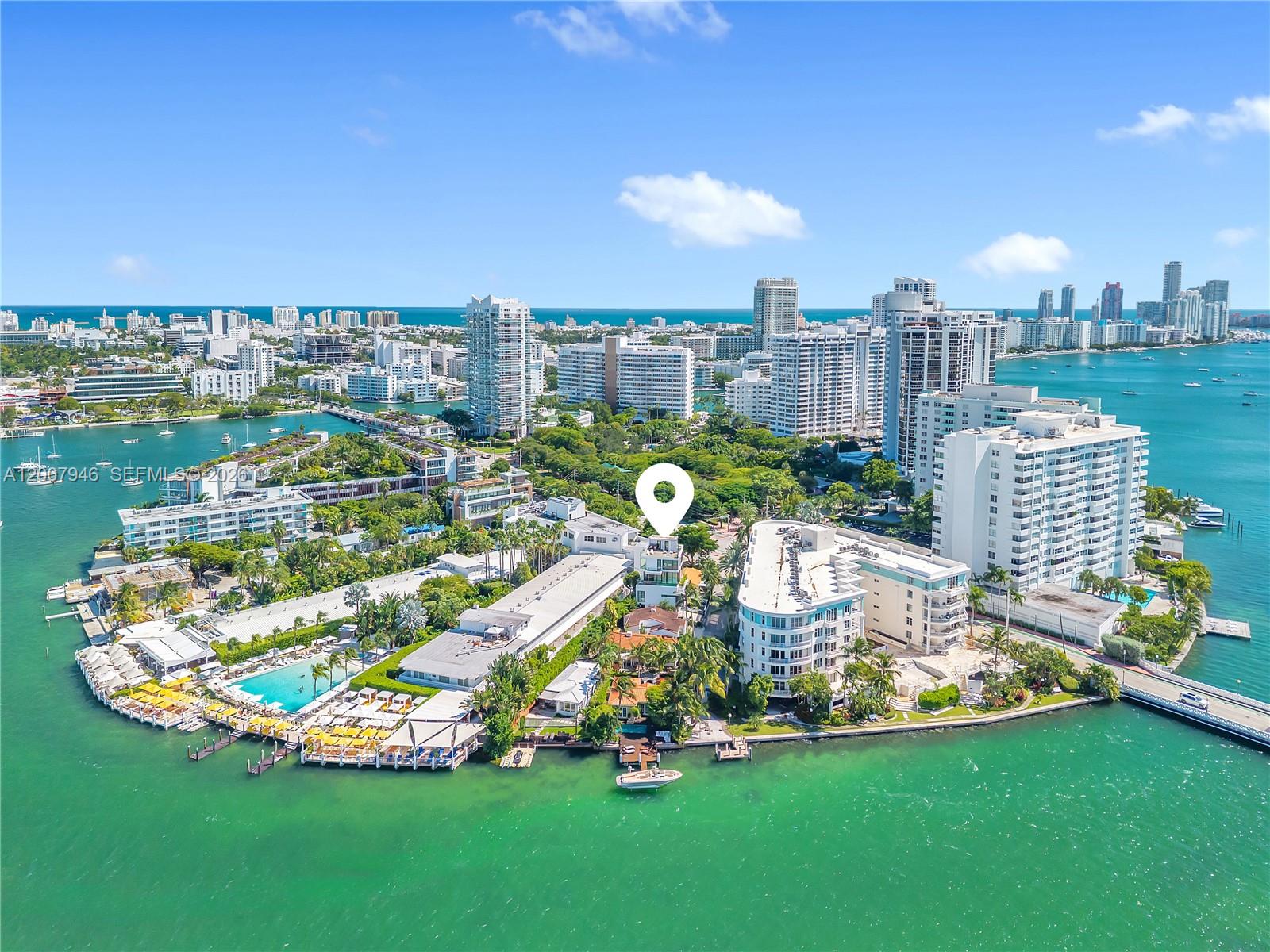 An aerial view shows a waterfront residential property on an island surrounded by high-rise buildings — 11 Century Ln, Miami Beach FL 33139, MIAMI BEACH, FL