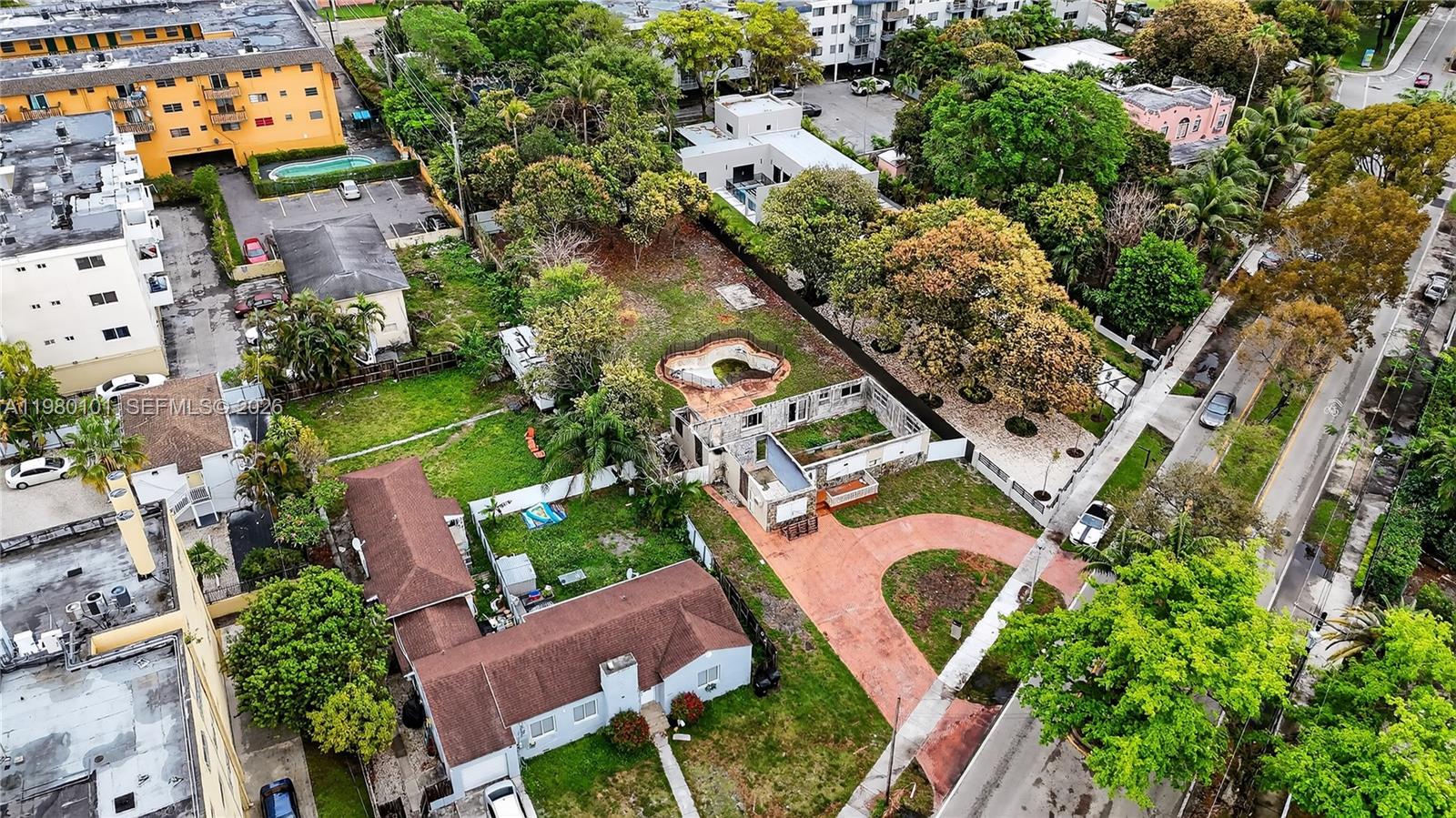An aerial view shows a residential lot with a house, a pool, and landscaping — 12395 Griffing Blvd, North Miami FL 33161, NORTH MIAMI, FL