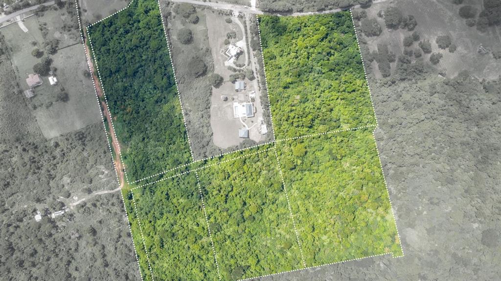 An aerial view shows several adjacent plots of land with dense vegetation and some buildings — Lot 5 CARR 201 KM.HM 5.8, VIEQUES, PR