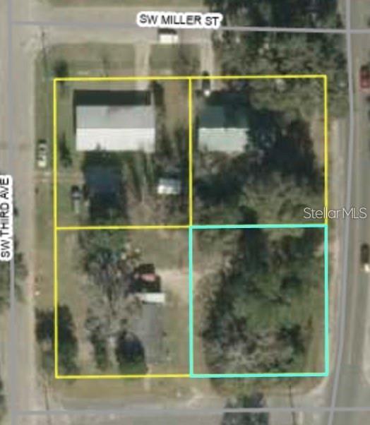 This is an aerial map showing four adjacent land parcels, with one highlighted in light blue — SW ML KING JR DRIVE, MADISON, FL