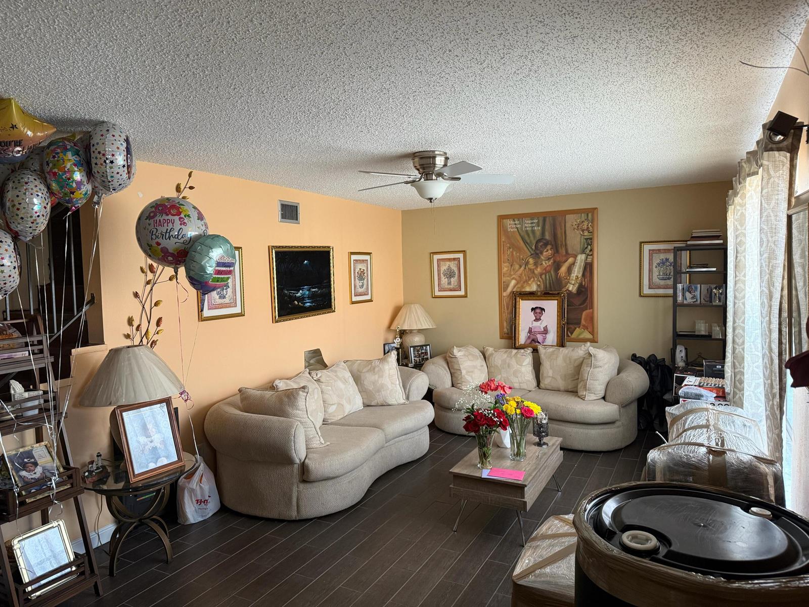 A living room features two beige sofas, a coffee table, and birthday balloons — 76 Ann Lee Lane, Tamarac FL 33319, TAMARAC, FL