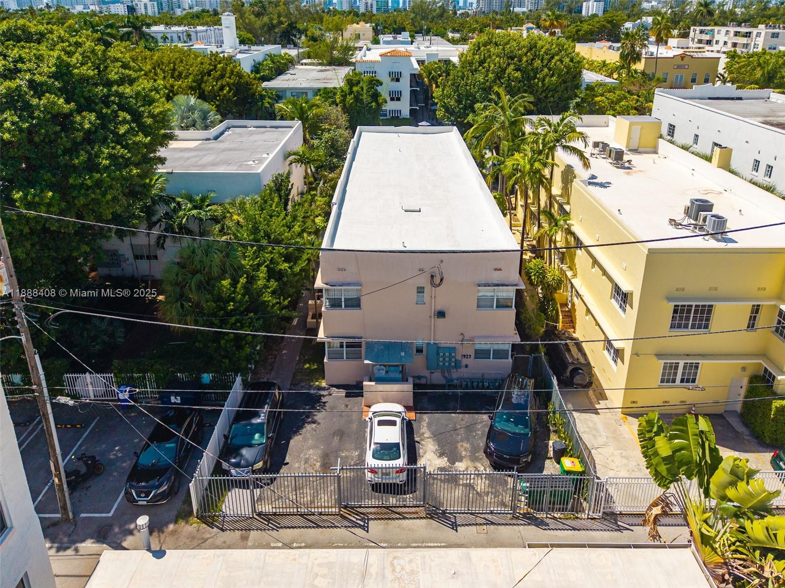 An aerial view shows a multi-story apartment building with a parking lot in front — 1329 Pennsylvania Ave, Miami Beach FL 33139, MIAMI BEACH, FL