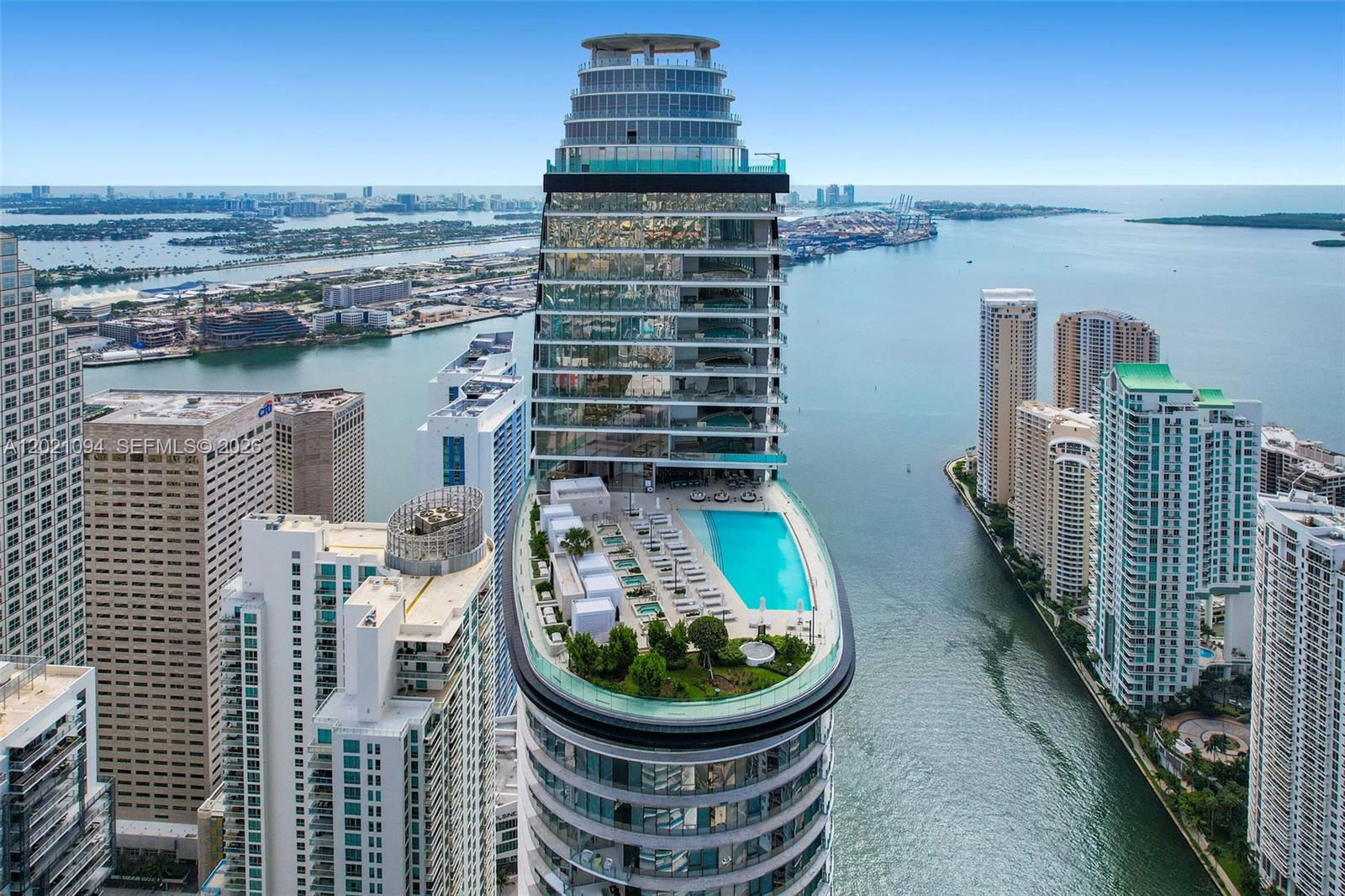 An aerial view of a high-rise building featuring a large outdoor pool and garden terrace — 300 Biscayne Blvd Way # 3404C, Miami FL 33131, MIAMI, FL