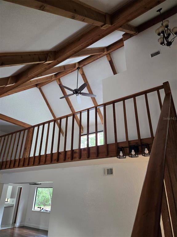 A small room with wood-look flooring, white walls, and a recessed ceiling feature — 1743 ITCHEPACKESASSA DRIVE, LAKELAND, FL
