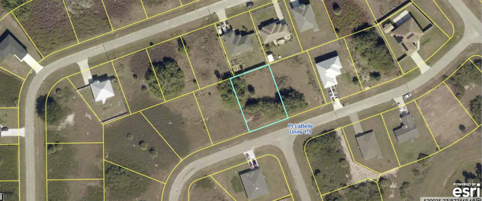 This is an aerial map showing a vacant residential lot outlined in light blue — 7058 Calder Circle, FL 33935, FL