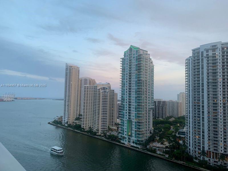An elevated view of a waterway with a boat and several high-rise residential buildings — 300 S Biscayne Blvd # 1908, Miami FL 33131, MIAMI, FL