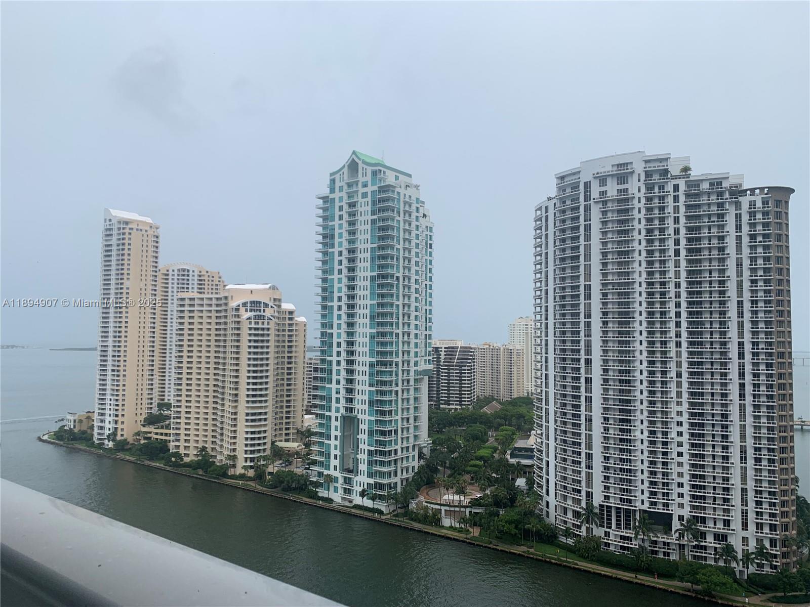 A view of several high-rise residential buildings situated along a waterfront — 300 S Biscayne Blvd # 1908, Miami FL 33131, MIAMI, FL