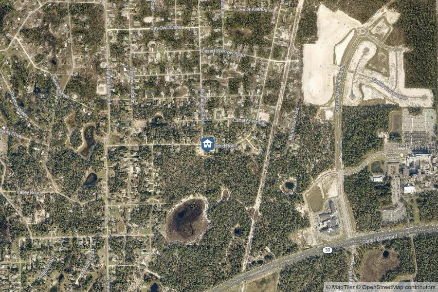 This is an aerial map showing a residential area with roads and a large pond — LOT 1 NIGHTINGALE ROAD, BROOKSVILLE, FL
