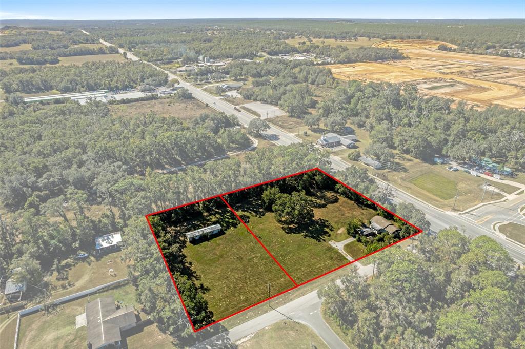 An aerial view shows two adjacent rectangular lots with structures, outlined in red — 3228 & 3164 W LAUREL STREET, LECANTO, FL