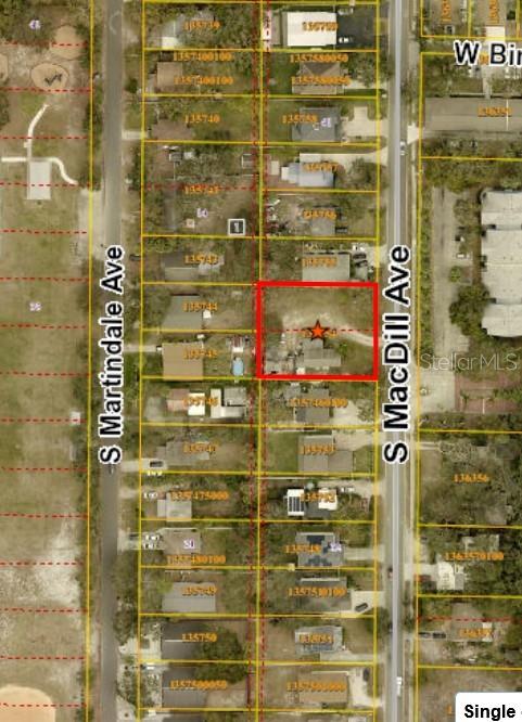 This is an aerial map view showing a residential property highlighted in red — 6313 S MACDILL AVENUE, TAMPA, FL