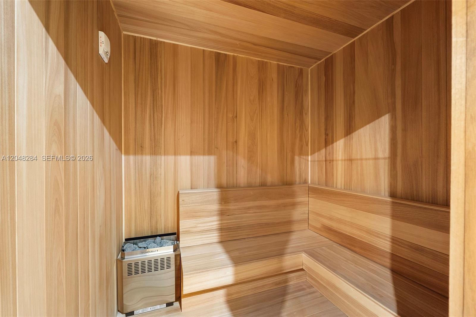 This sauna features light-toned wood paneling, a built-in corner bench, and a wall-mounted heater — 90 NE 32 # 514, Miami FL 33127, MIAMI, FL