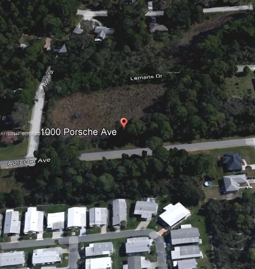 This is an aerial map view of a vacant, wooded lot bordered by residential streets — 1000 PORCHE, Sebring FL 33872, SEBRING, FL