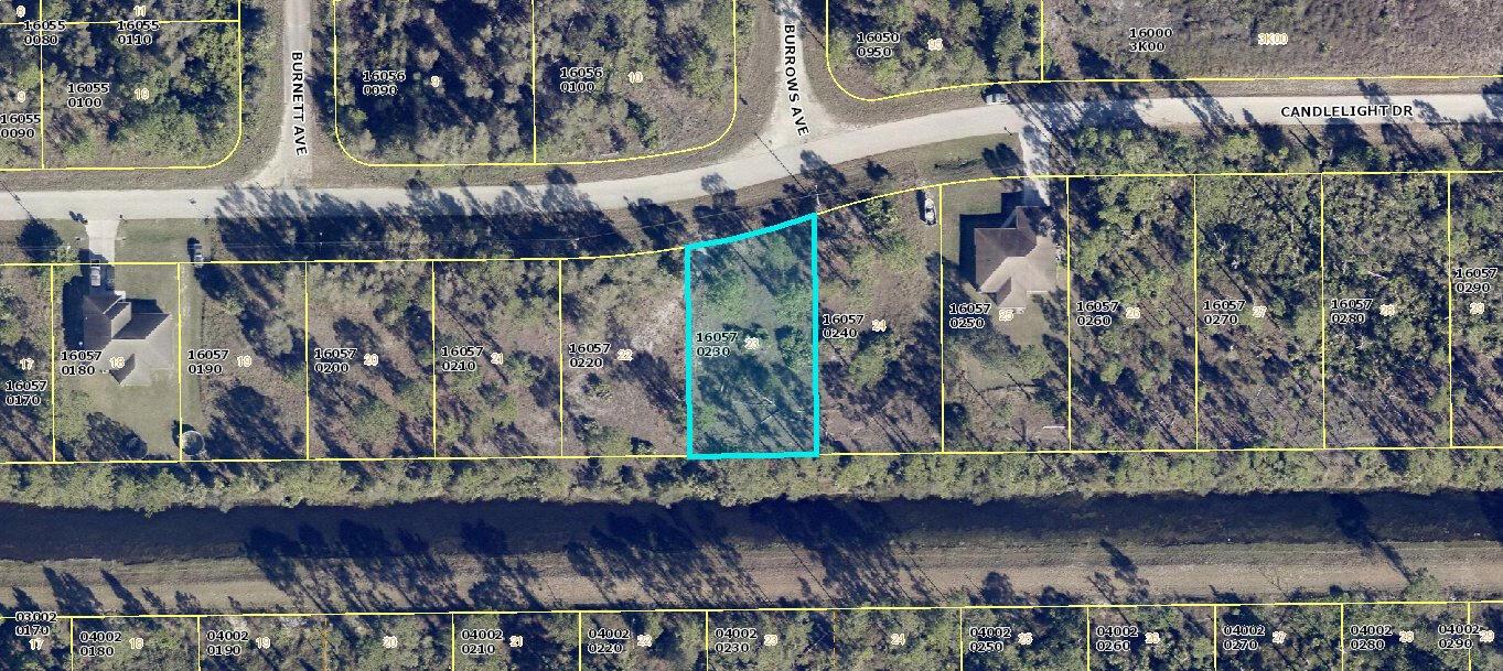 This is an aerial map showing a highlighted vacant residential lot among neighboring properties — 1048 Candlelight Drive, Lehigh Acres FL 33974, LEHIGH ACRES, FL