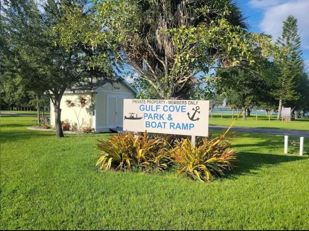 A sign for Gulf Cove Park and Boat Ramp stands in a grassy yard — 5281 BOYLE TERRACE, PORT CHARLOTTE, FL