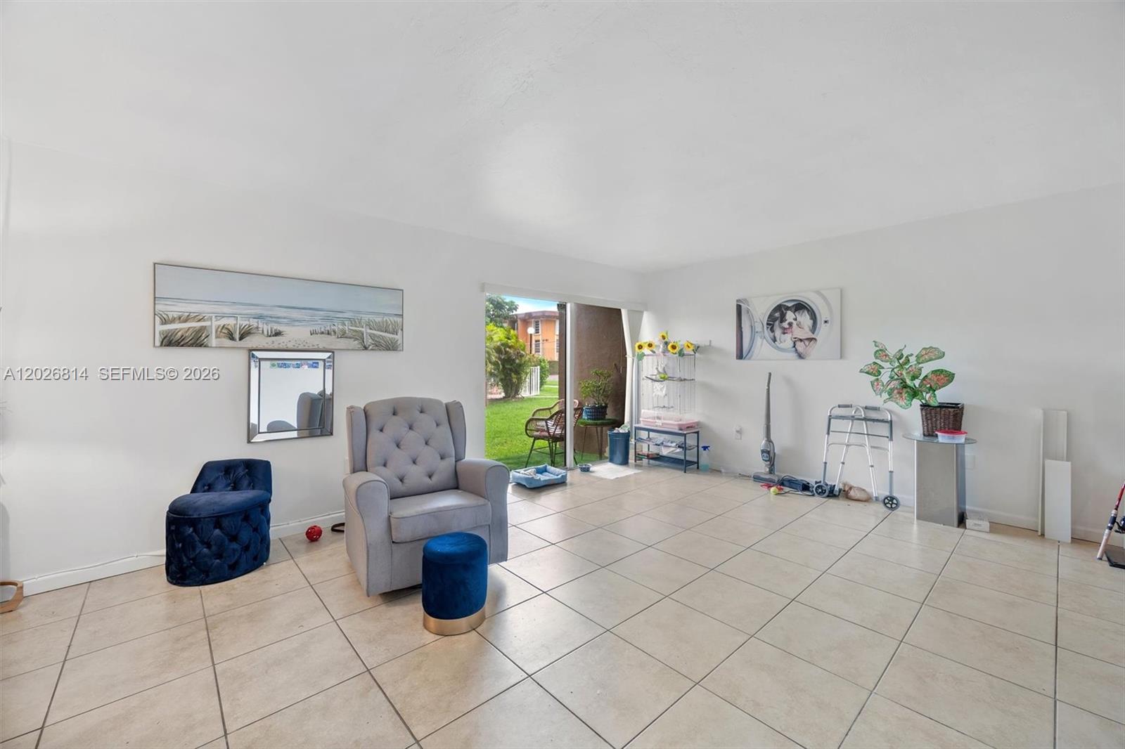 This bathroom features a white vanity, a toilet, and a shower with a blue curtain — 9445 SW 76th St # U4, Miami FL 33173, MIAMI, FL