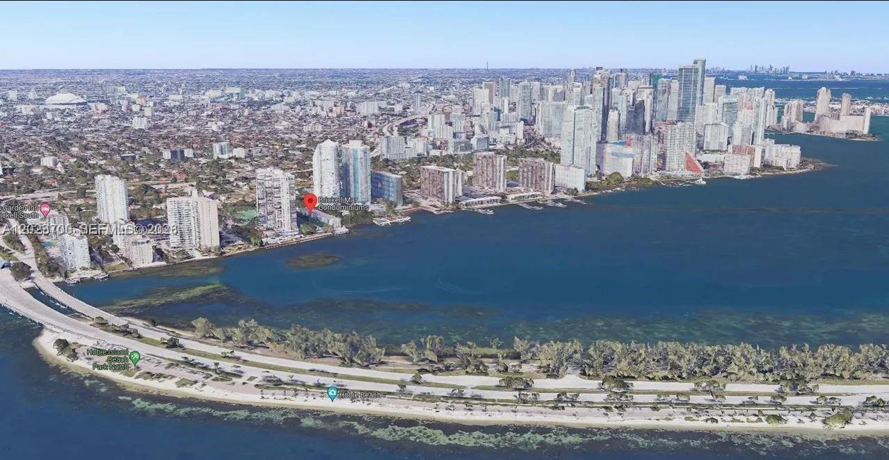 An aerial view of the Miami coastline featuring high-rise condominiums along the water — 2201 Brickell Ave # 61, Miami FL 33129, MIAMI, FL