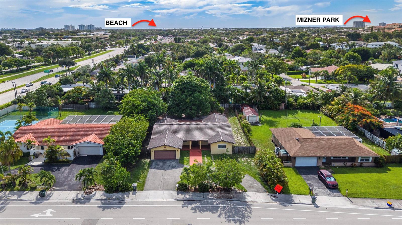 An aerial view shows three suburban houses with driveways and lawns along a paved road — 1200 NW 4TH Avenue, Boca Raton FL 33432, BOCA RATON, FL