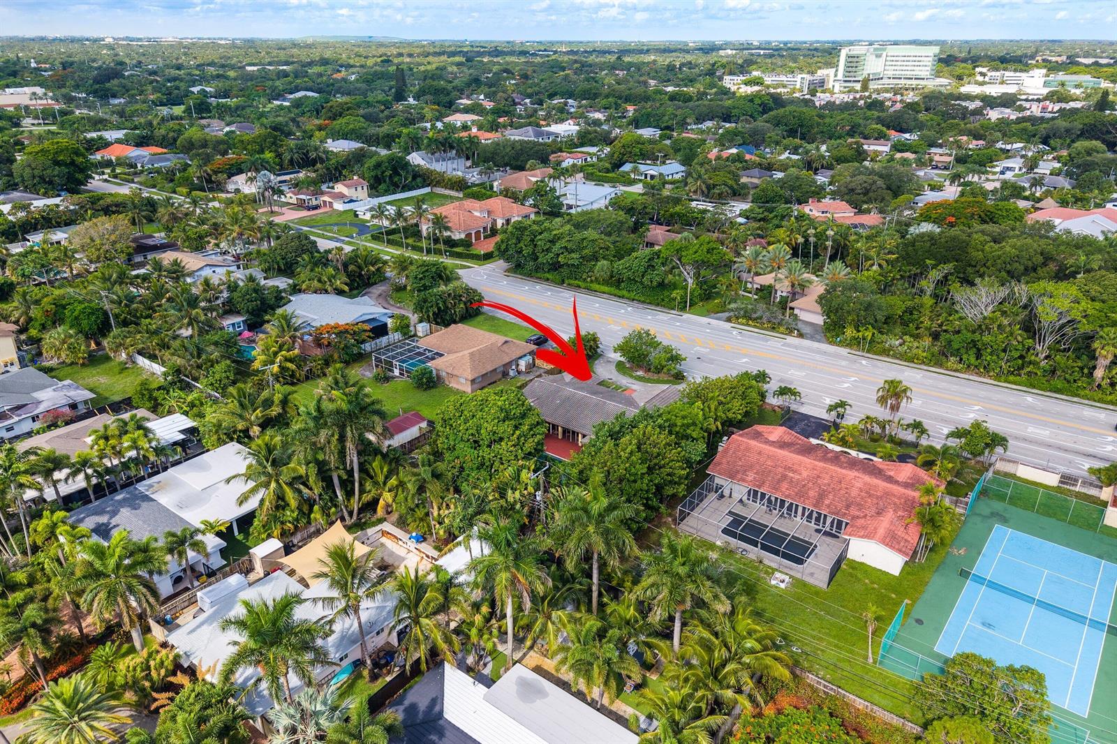 An aerial view shows a residential house with a red arrow pointing to its roof — 1200 NW 4TH Avenue, Boca Raton FL 33432, BOCA RATON, FL
