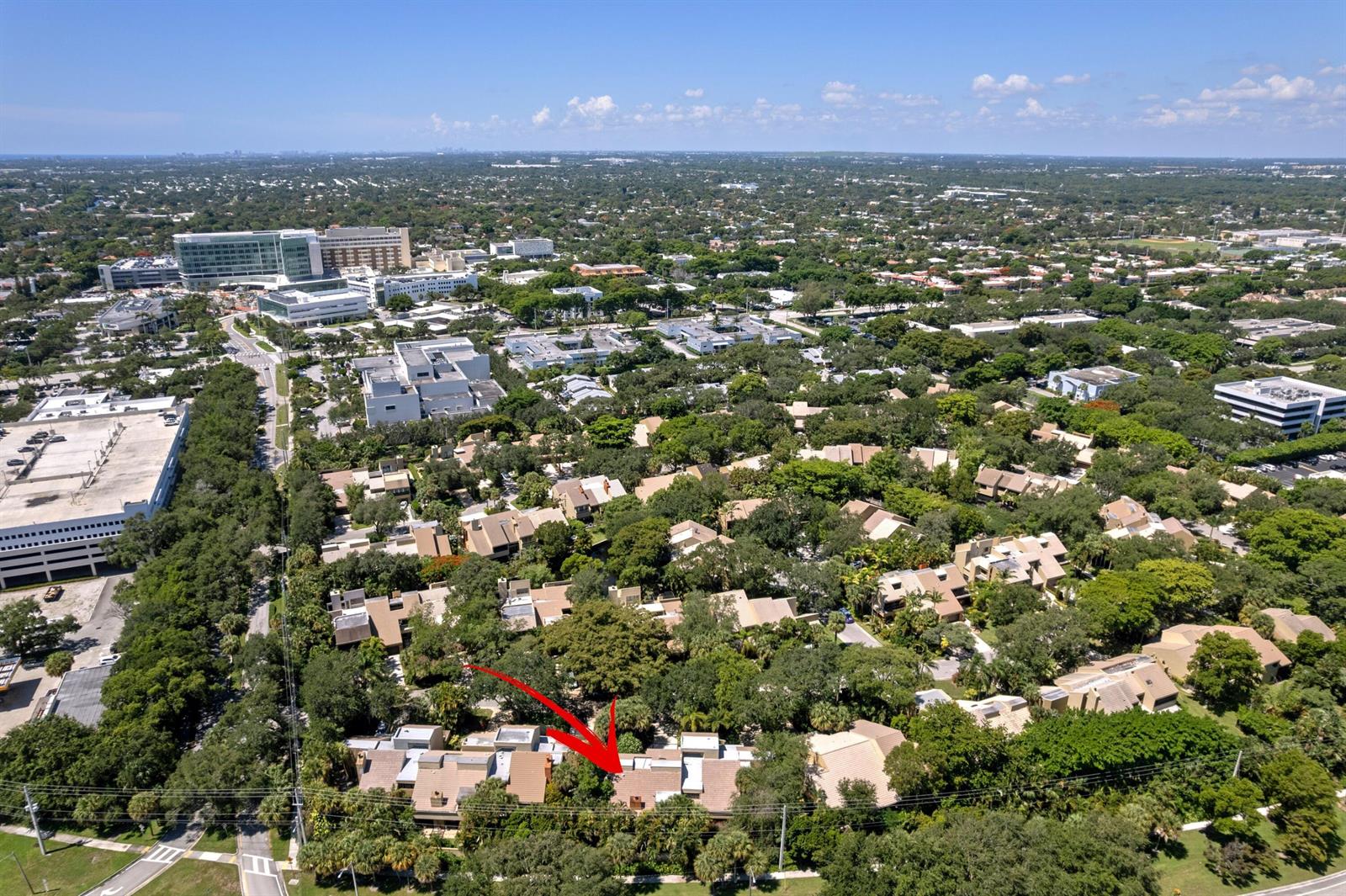 An aerial view shows a residential complex surrounded by trees with a red arrow pointing down — 793 Saint Albans Drive, Boca Raton FL 33486, BOCA RATON, FL