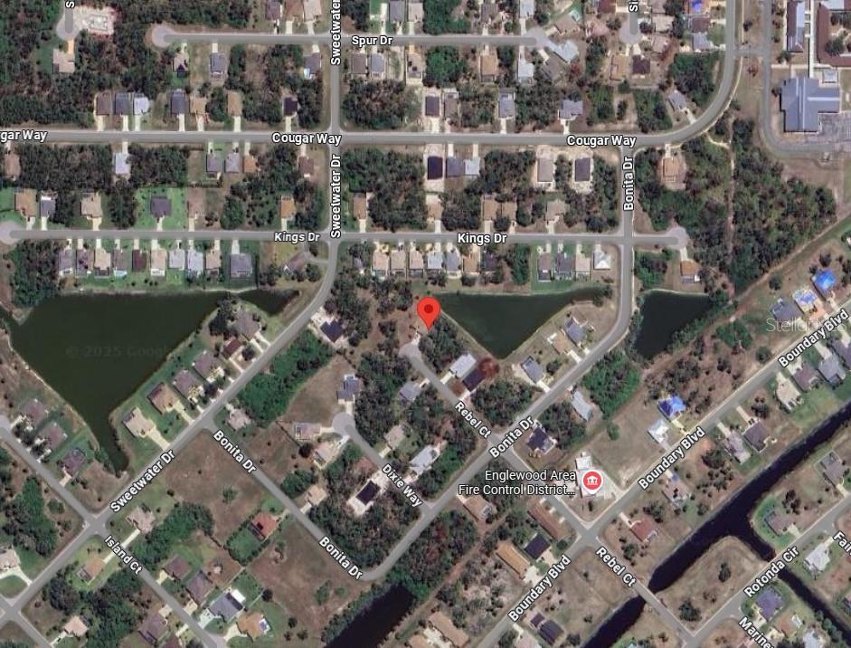 This is a satellite map view of a residential neighborhood with a red location marker — 104 REBEL COURT, ROTONDA WEST, FL