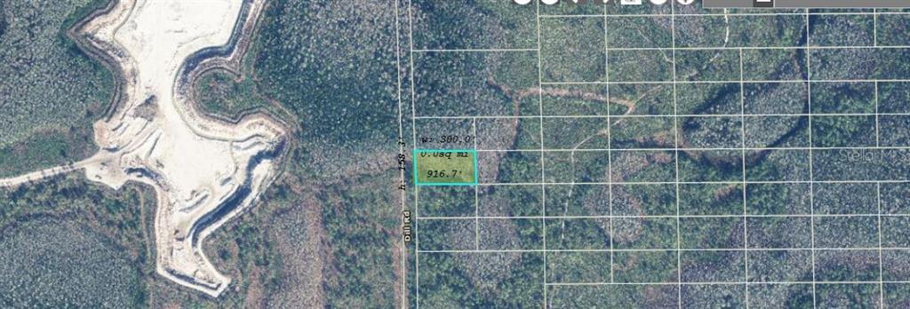 This aerial map shows a rectangular parcel of land highlighted in blue along a road — 1001 DILL ROAD, ORLANDO, FL