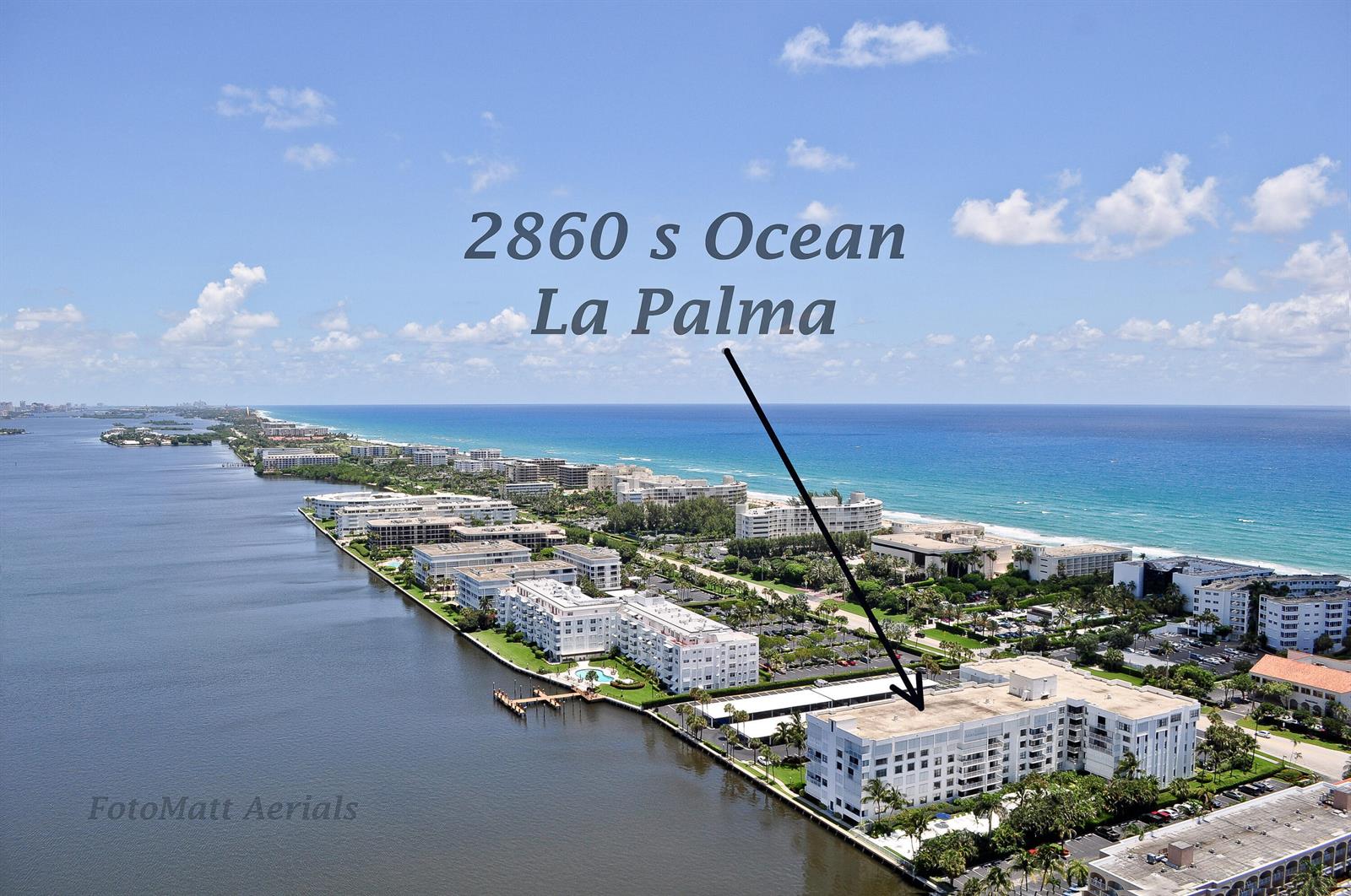 An aerial view shows a multi-story residential building situated between a waterway and the ocean — 2860 S Ocean Boulevard # 301, Palm Beach FL 33480, PALM BEACH, FL