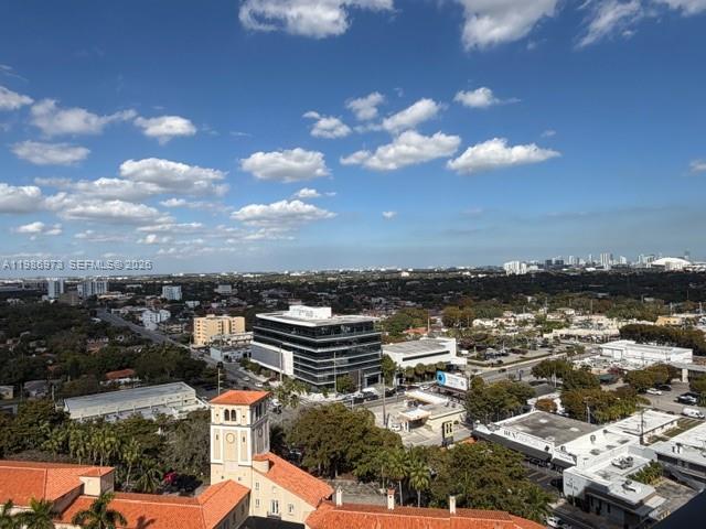 An elevated view of a city landscape featuring buildings, trees, and a blue sky — 888 S Douglas Rd, Coral Gables FL 33134, CORAL GABLES, FL