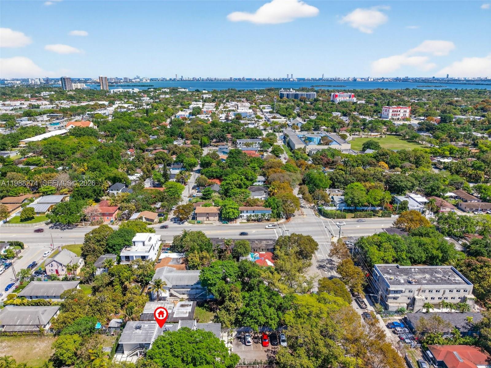 An aerial view shows a residential neighborhood with a red house icon marking a building — 37 NW 59th St # 4, Miami FL 33127, MIAMI, FL