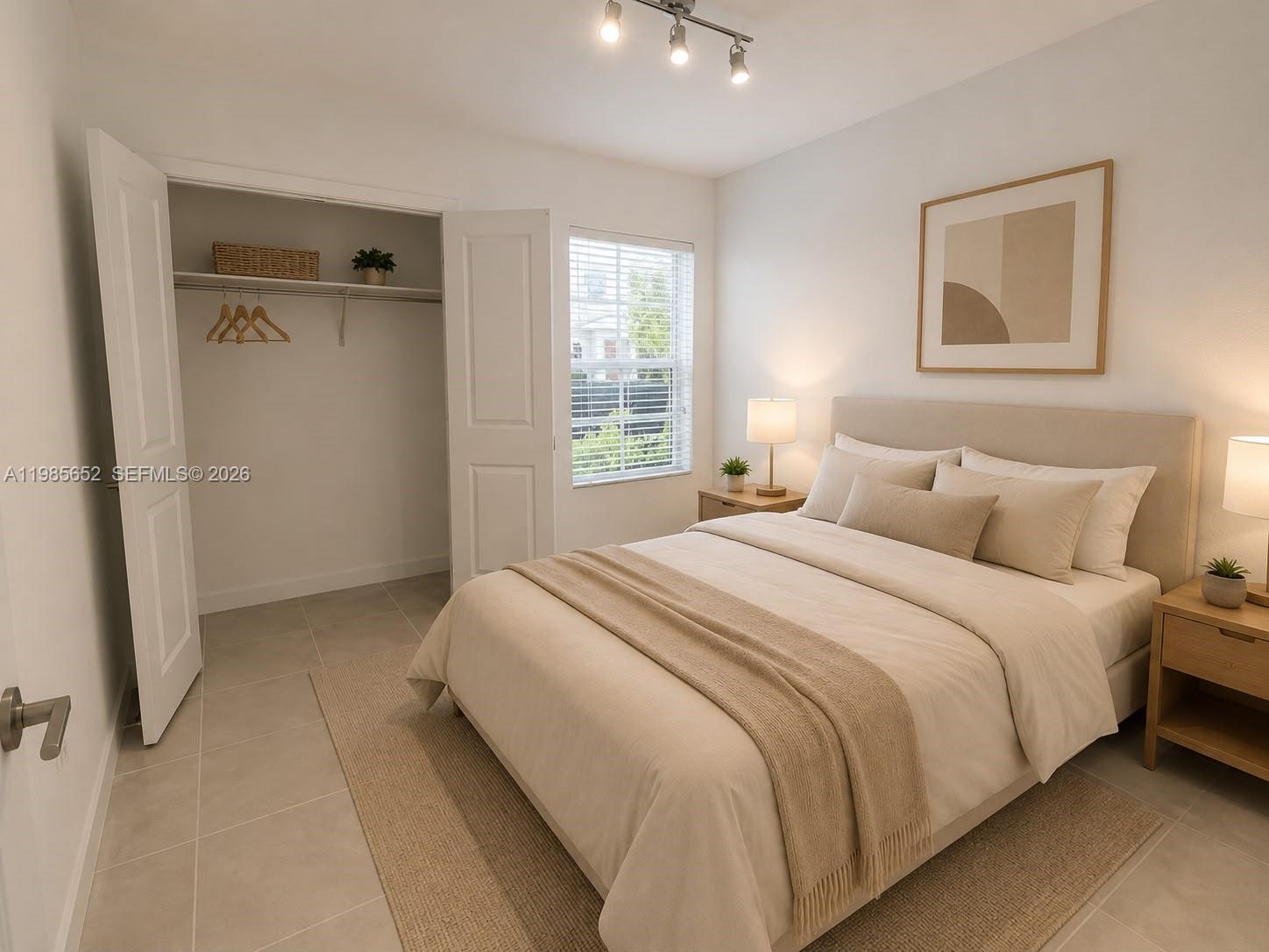 A bedroom features a queen bed, two nightstands, a closet, and tile flooring — 495 NE 5th Ln, Florida City FL 33034, FLORIDA CITY, FL