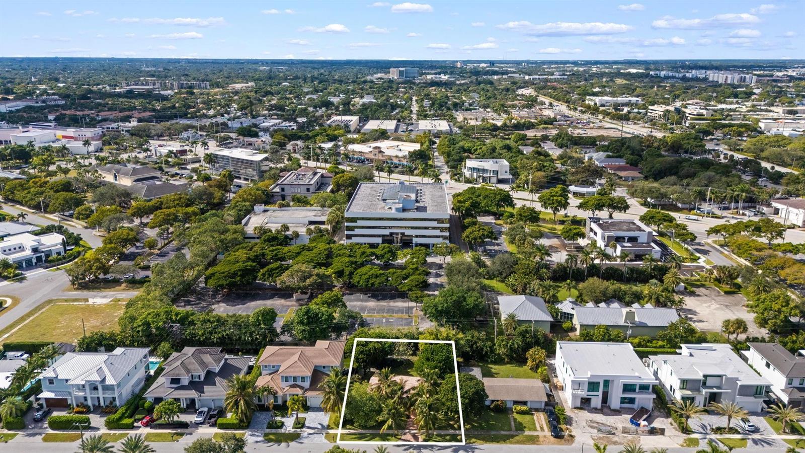 An aerial view shows a rectangular residential lot outlined in white amidst a suburban neighborhood — 1001 NE 2nd Terrace, Boca Raton FL 33432, BOCA RATON, FL