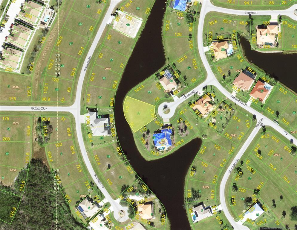 This is an aerial map showing residential lots and a waterway in a suburban neighborhood — 17333 VOGUE COURT, PUNTA GORDA, FL