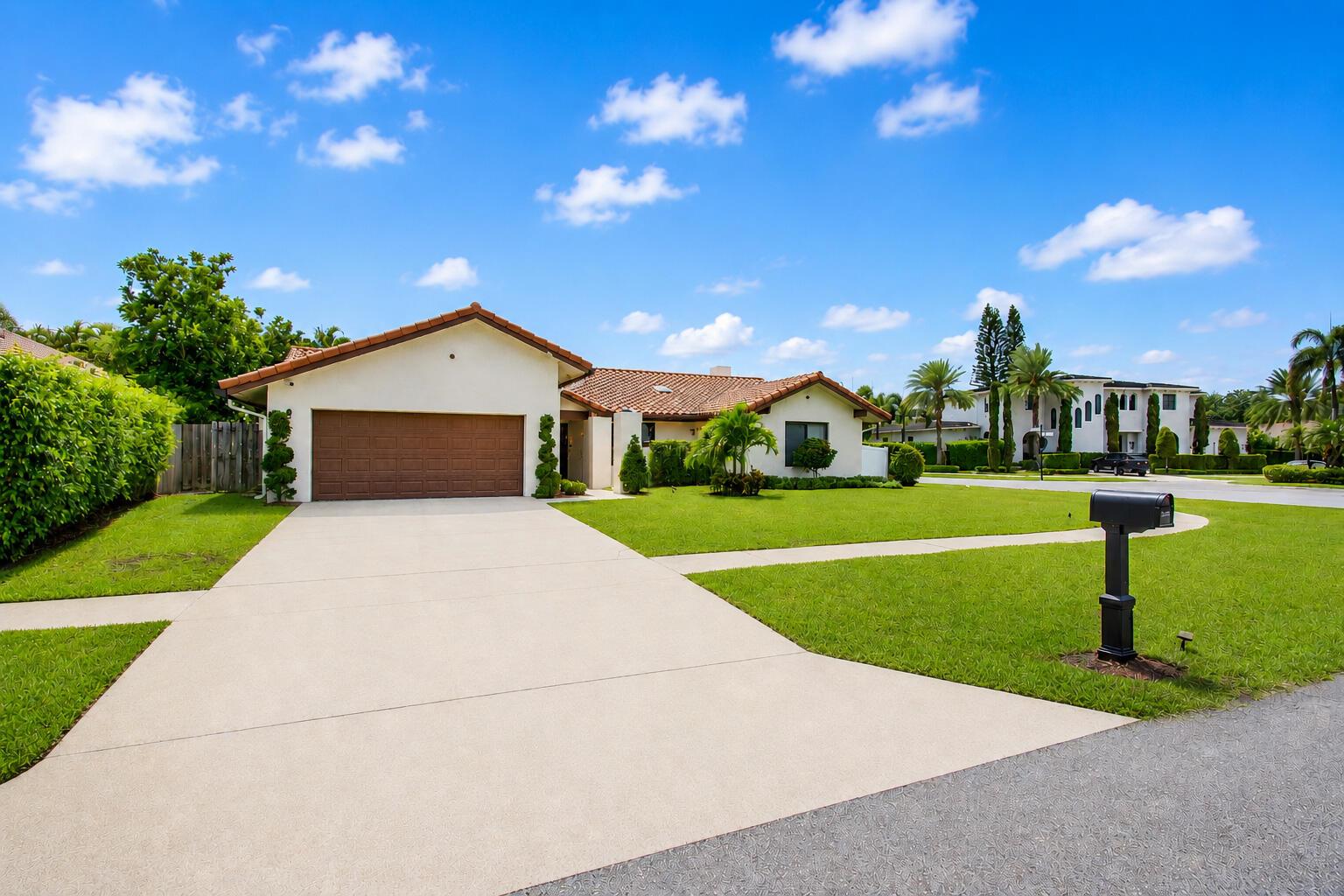 A single-story house with a brown garage door, tiled roof, and a concrete driveway — 22209 Morning Glory Terrace, Boca Raton FL 33433, BOCA RATON, FL