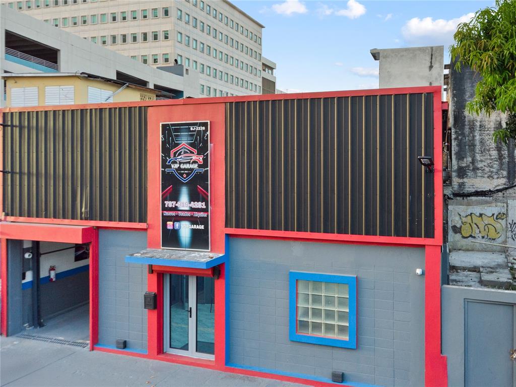 An exterior view of a commercial building with a black metal facade and red trim — 1195 DEL CARMEN STREET, SAN JUAN, PR