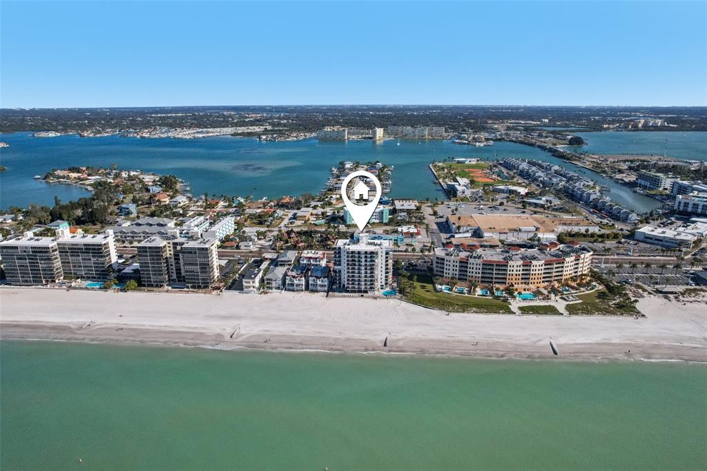 An aerial view shows a beachfront high-rise condominium building marked with a location pin — 15316 GULF BOULEVARD UNIT 801, MADEIRA BEACH, FL