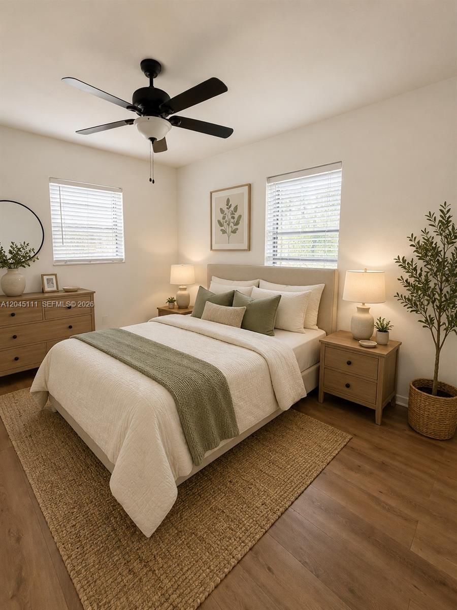 A bedroom features a bed with green accents, two nightstands, a dresser, and a ceiling fan — 11601 Pinkston Dr, Miami FL 33176, MIAMI, FL
