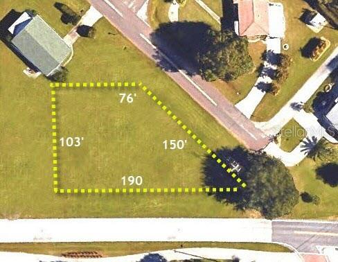 An aerial map shows a vacant, irregularly shaped residential lot outlined in yellow with dimensions — 590 SHREVE STREET, PUNTA GORDA, FL
