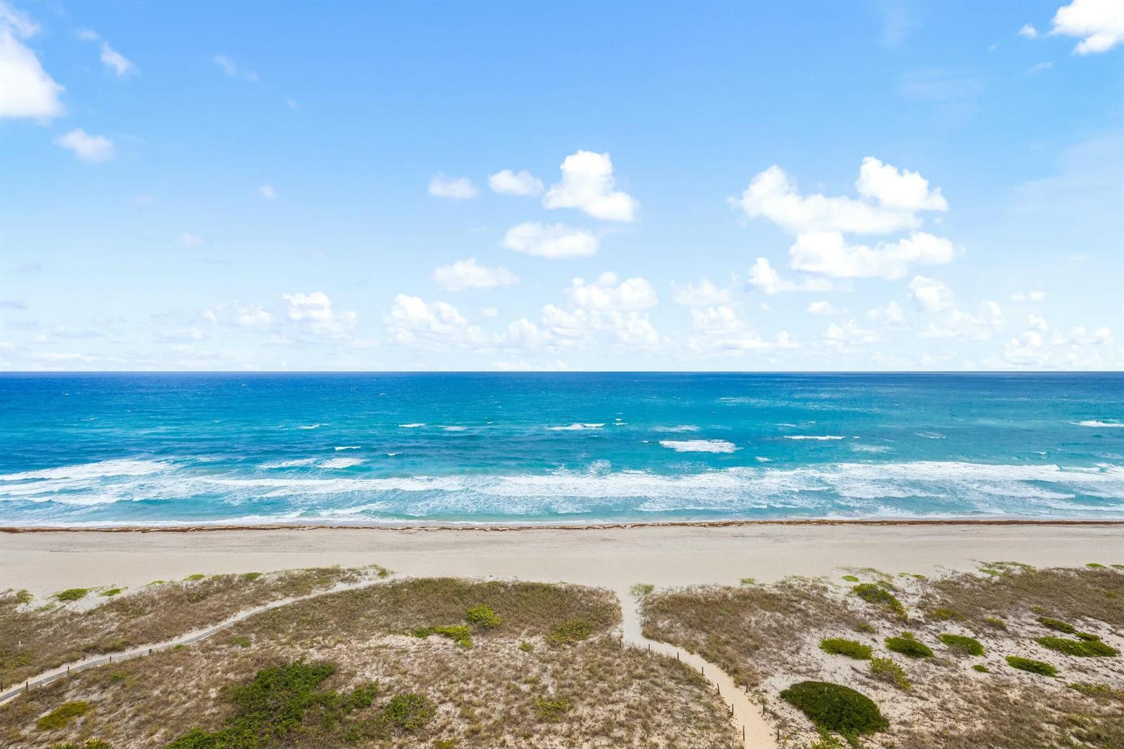 An aerial view shows a sandy beach, dunes with vegetation, and the blue ocean — 2500 S Ocean Boulevard # 903, Boca Raton FL 33432, BOCA RATON, FL