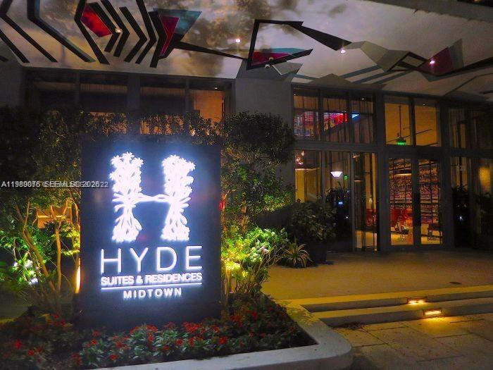 The exterior entrance of Hyde Suites and Residences Midtown features a glowing illuminated sign — 121 NE 34th St # 2115, Miami FL 33137, MIAMI, FL